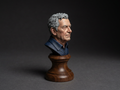 Hand-painted portrait bust of a man on a turned hardwood base